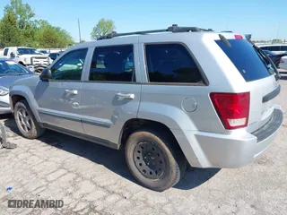 2009 Jeep Grand Cherokee Laredo with VIN 1J8GS48K99C528145, listed as a IAAI auction lot 42077024 with 167,588 mi miles. Bid and sale history available at carsss.com. Image 3.