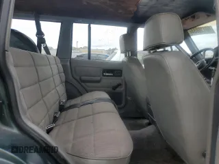 1993 Jeep Cherokee Sport with VIN 1J4FT68S4PL588241, listed as a Copart auction lot 80115884 with 204,174 mi miles and Salvage Title. Bid and sale history available at carsss.com. Image 10.