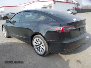 2022 Tesla Model 3 Long Range with VIN 5YJ3E1EB6NF343869, listed as a IAAI auction lot 41826077 with 36,643 mi miles and . Bid and sale history available at DreamBid. Image 3.