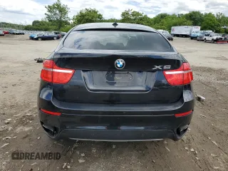 2012 BMW X6 50i z VIN 5UXFG8C51CLZ97393, wystawiony jako Copart lot #58407285 z przebiegiem 128 040 mil mil oraz Szkoda całkowita • Salvage title. Historia ofert i sprzedaży dostępna na DreamBid. Obrazek 6.