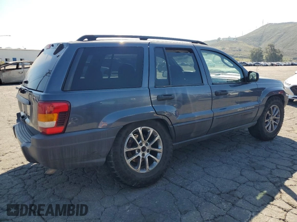 2003 Jeep Grand Cherokee Laredo with VIN 1J4GX48S73C539185, listed as a Copart auction lot 46687915 with 265,008 mi miles and Salvage Title. Bid and sale history available at carsss.com. Image 3.