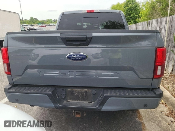 2020 Ford F-150 XL with VIN 1FTEW1E54LKD15116, listed as a IAAI auction lot 42184464 with 99,999 mi miles. Bid and sale history available at carsss.com. Image 1.