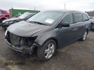 2012 Honda Odyssey Touring with VIN 5FNRL5H99CB071010, listed as a IAAI auction lot 41651233 with 186,913 mi miles. Bid and sale history available at carsss.com. Image 2.