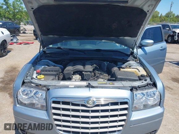 2006 Chrysler 300 Touring with VIN 2C3KA53G56H324954, listed as a IAAI auction lot 42058478 with 124,933 mi miles. Bid and sale history available at carsss.com. Image 10.