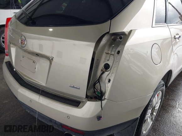 2013 Cadillac SRX Performance Collection z VIN 3GYFNCE31D5611616, wystawiony jako IAAI lot #42119169 z przebiegiem 159 019 mil mil oraz . Historia ofert i sprzedaży dostępna na DreamBid. Obrazek 6.