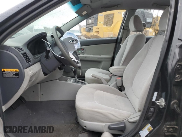 2009 Kia Spectra EX with VIN KNAFE222495648220, listed as a Copart auction lot 52886915 with 146,417 mi miles and Salvage title. Bid and sale history available at DreamBid. Image 7.