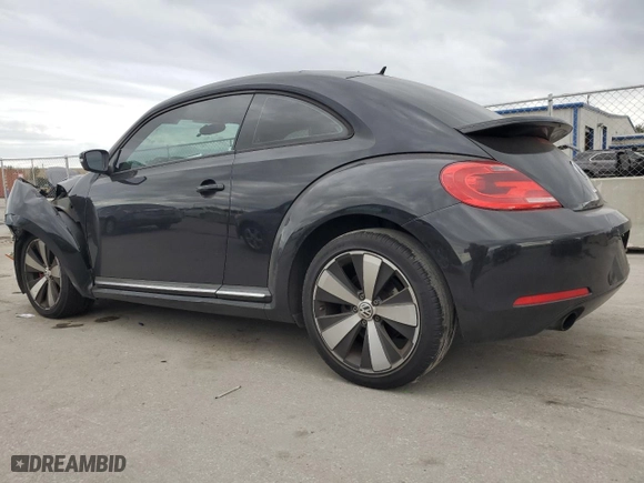 2012 Volkswagen Beetle 2.0T Turbo w/Sun/Sound with VIN 3VWV67AT2CM664806, listed as a Copart auction lot 86595164 with 158,239 mi miles and Salvage Title. Bid and sale history available at carsss.com. Image 2.