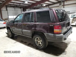 1997 Jeep Grand Cherokee Laredo with VIN 1J4GZ58S6VC573007, listed as a Copart auction lot 42728355 with 164,269 mi miles and Salvage Title. Bid and sale history available at carsss.com. Image 2.