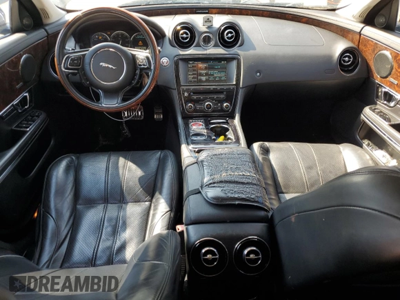 2015 Jaguar XJ with VIN SAJWA1CZ7F8V83167, listed as a Copart auction lot 74991144 with 94,502 mi miles and Salvage Title. Bid and sale history available at carsss.com. Image 8.