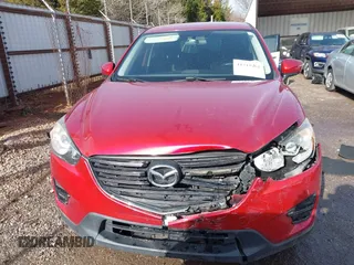 2016 Mazda CX-5 Sport with VIN JM3KE2BY3G0754391, listed as a IAAI auction lot 41719461 with 79,130 mi miles. Bid and sale history available at carsss.com. Image 12.