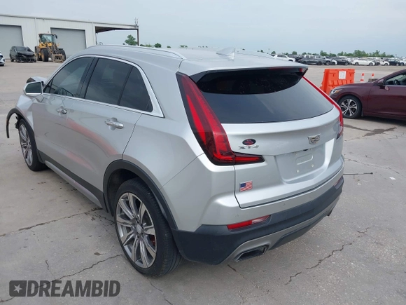 2019 Cadillac XT4 FWD Premium Luxury z VIN 1GYFZCR42KF189610, wystawiony jako IAAI lot #42137690 z przebiegiem 92 502 mil mil oraz . Historia ofert i sprzedaży dostępna na DreamBid. Obrazek 3.