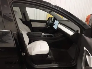 2021 Tesla Model Y Long Range with VIN 5YJYGAEE5MF305655, listed as a IAAI auction lot 41860993 with 50,750 mi miles. Bid and sale history available at carsss.com. Image 5.