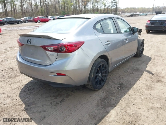 2016 Mazda Mazda3 i Sport with VIN JM1BM1T71G1335980, listed as a IAAI auction lot 42003186 with 131,015 mi miles. Bid and sale history available at carsss.com. Image 4.