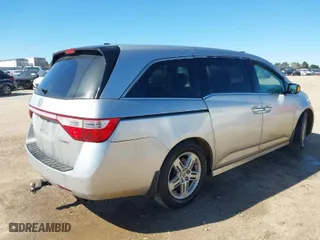 2013 Honda Odyssey Touring with VIN 5FNRL5H93DB076463, listed as a IAAI auction lot 41819994 with 188,911 mi miles. Bid and sale history available at carsss.com. Image 4.