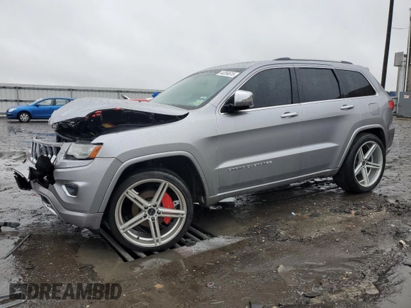 2014 Jeep Grand Cherokee Overland with VIN 1C4RJECG9EC341865, listed as a Copart auction lot 44354615 with 141,601 mi miles and Salvage Title. Bid and sale history available at carsss.com. Image 1.