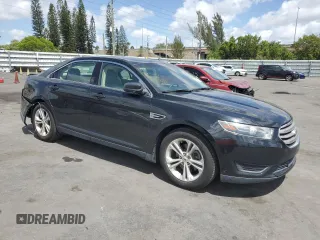 2015 Ford Taurus SE with VIN 1FAHP2D86FG140750, listed as a Copart auction lot 54390145 with 128,163 mi miles and Salvage Title. Bid and sale history available at carsss.com. Image 4.