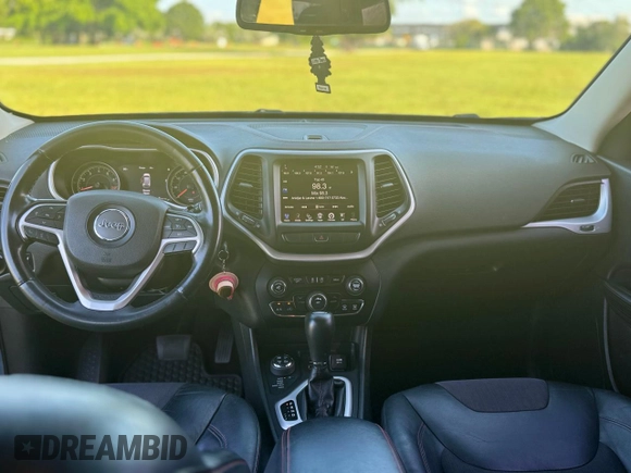 2015 Jeep Cherokee Trailhawk with VIN 1C4PJMBS1FW529559, listed as a Copart auction lot 66581755 with 113,915 mi miles and Salvage title. Bid and sale history available at DreamBid. Image 9.