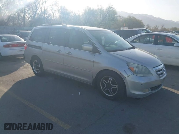 2005 Honda Odyssey TOURING with VIN 5FNRL38875B004209, listed as a IAAI auction lot 42003057 with 242,794 mi miles. Bid and sale history available at carsss.com. Image 1.