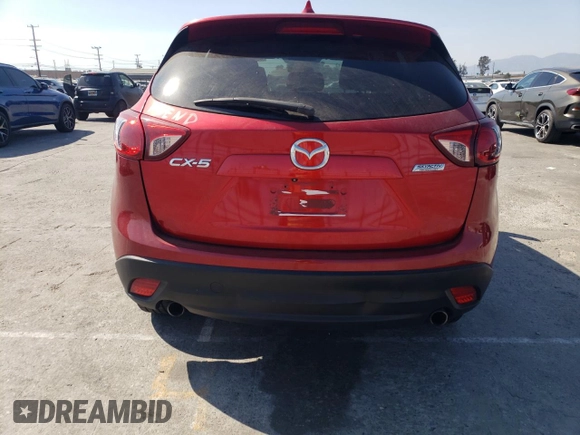 2014 Mazda CX-5 Touring with VIN JM3KE2CY9E0356050, listed as a Copart auction lot 65470674 with 70,400 mi miles and Salvage Title. Bid and sale history available at DreamBid. Image 6.