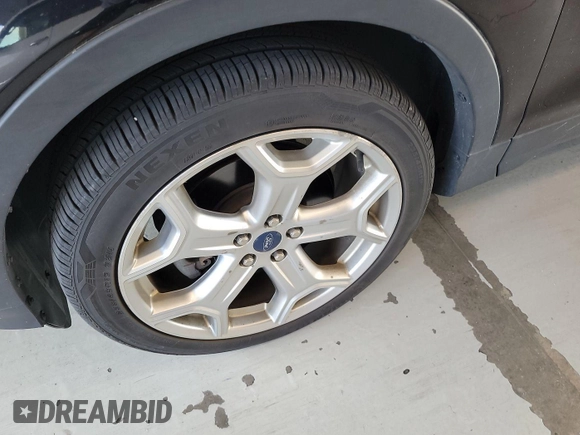 2019 Ford Escape Titanium with VIN 1FMCU9J96KUA01051, listed as a IAAI auction lot 42841649 with 69,720 mi miles and . Bid and sale history available at DreamBid. Image 22.