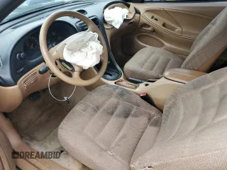 1997 Ford Mustang z VIN 1FALP4049VF169429, wystawiony jako Copart lot #59153175 z przebiegiem 134 454 mil mil oraz Szkoda całkowita • Salvage title. Historia ofert i sprzedaży dostępna na DreamBid. Obrazek 7.
