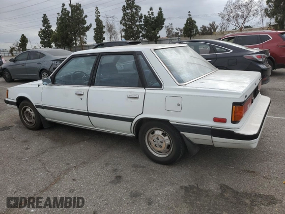 1984 Toyota Camry z VIN JT2SV16E3E0220882, wystawiony jako Copart lot #53514345 z przebiegiem 112 430 mil mil oraz Czysty tytuł • Clean title. Historia ofert i sprzedaży dostępna na DreamBid. Obrazek 2.