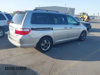 2005 Honda Odyssey TOURING with VIN 5FNRL38875B004209, listed as a IAAI auction lot 42003057 with 242,794 mi miles. Bid and sale history available at carsss.com. Image 4.