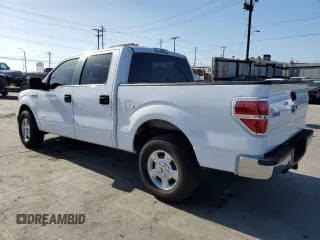 2014 Ford F-150 XL with VIN 1FTFW1CT1EKE22892, listed as a Copart auction lot 61635265 with 14,203 mi miles and Salvage title. Bid and sale history available at DreamBid. Image 2.