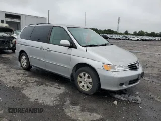2003 Honda Odyssey EX z VIN 5FNRL18603B008148, wystawiony jako Copart lot #60669825 z przebiegiem 128 115 mil mil oraz Czysty tytuł • Clean title. Historia ofert i sprzedaży dostępna na DreamBid. Obrazek 4.