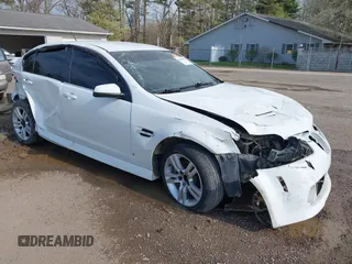 2009 Pontiac G8 with VIN 6G2ER57729L153123, listed as a IAAI auction lot 42046031 with 100,419 mi miles. Bid and sale history available at carsss.com. Image 1.
