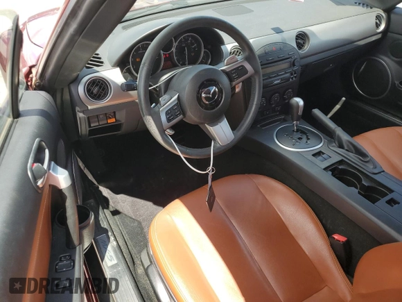 2008 Mazda MX-5 Miata Grand Touring z VIN JM1NC26F580144269, wystawiony jako Copart lot #56586405 z przebiegiem 52 871 mil mil oraz Szkoda całkowita • Salvage title. Historia ofert i sprzedaży dostępna na DreamBid. Obrazek 8.