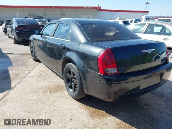 2005 Chrysler 300 with VIN 2C3JA43R65H668010, listed as a IAAI auction lot 41976405 with 216,099 mi miles. Bid and sale history available at carsss.com. Image 3.