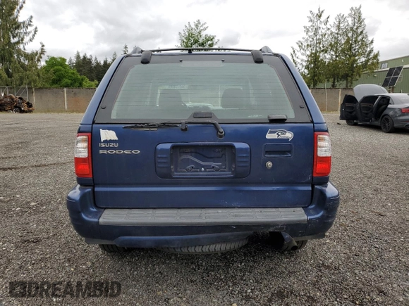 2002 Isuzu Rodeo S with VIN 4S2CK58W124301647, listed as a Copart auction lot 56973895 with 129,009 mi miles and Salvage title. Bid and sale history available at DreamBid. Image 6.