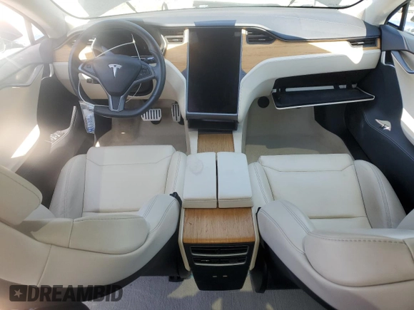 2019 Tesla Model S 100D with VIN 5YJSA1E42KF331240, listed as a Copart auction lot 54713975 with 43,940 mi miles and Salvage title. Bid and sale history available at DreamBid. Image 8.