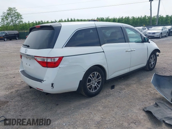 2012 Honda Odyssey EX-L with VIN 5FNRL5H62CB059481, listed as a IAAI auction lot 42241415 with 135,244 mi miles and . Bid and sale history available at DreamBid. Image 4.