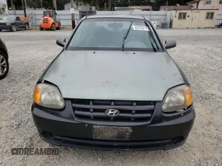 2004 Hyundai Accent GL with VIN KMHCG35C44U299645, listed as a Copart auction lot 63728174 with 159,604 mi miles and Clean Title. Bid and sale history available at carsss.com. Image 5.