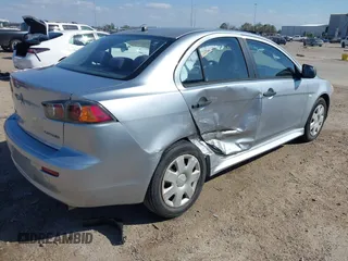 2010 Mitsubishi Lancer DE with VIN JA32U1FU4AU015574, listed as a IAAI auction lot 41770332 with 125,458 mi miles. Bid and sale history available at carsss.com. Image 4.