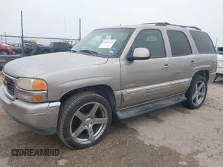 2003 GMC Yukon SLT with VIN 1GKEC13V33J287668, listed as a IAAI auction lot 41561108 with 326,719 mi miles. Bid and sale history available at carsss.com. Image 2.