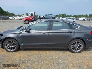 2020 Ford Fusion Hybrid Titanium with VIN 3FA6P0RU0LR141494, listed as a IAAI auction lot 39967898 with 88,152 mi miles. Bid and sale history available at carsss.com. Image 15.