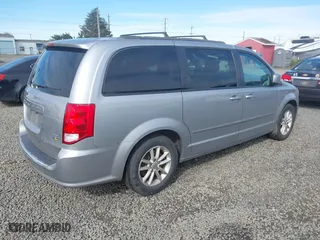 2015 Dodge Grand Caravan SXT with VIN 2C4RDGCG6FR556633, listed as a IAAI auction lot 42002783 with 157,341 mi miles. Bid and sale history available at carsss.com. Image 4.