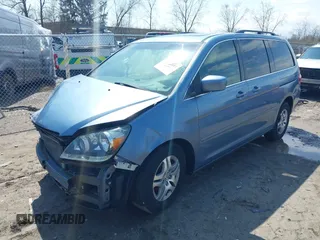 2007 Honda Odyssey EX-L with VIN 5FNRL38727B092077, listed as a IAAI auction lot 41972810 with 211,770 mi miles and . Bid and sale history available at DreamBid. Image 2.