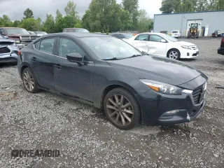 2017 Mazda 3 Touring with VIN JM1BN1V7XH1143503, listed as a Copart auction lot 58628085 with 181,345 mi miles and Salvage title. Bid and sale history available at DreamBid. Image 4.