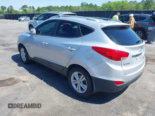 2013 Hyundai Tucson GLS with VIN KM8JU3AC3DU551018, listed as a IAAI auction lot 41988305 with 214,728 mi miles. Bid and sale history available at carsss.com. Image 3.