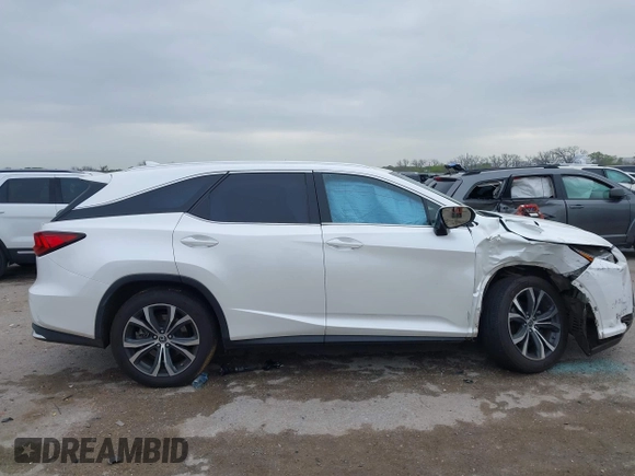 2018 Lexus RX 350L Premium z VIN JTJDZKCAXJ2010125, wystawiony jako IAAI lot #41899420 z przebiegiem 113 995 mil mil oraz . Historia ofert i sprzedaży dostępna na DreamBid. Obrazek 13.