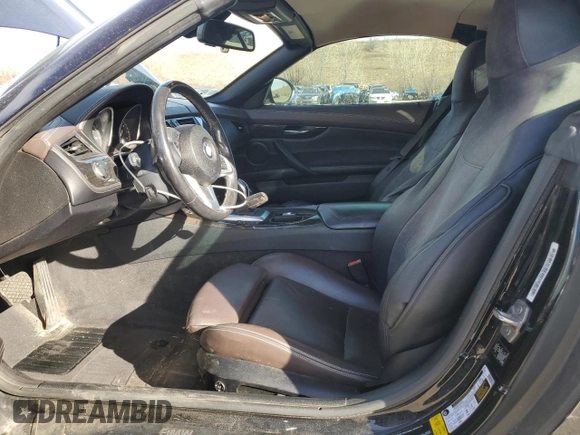 2013 BMW Z4 sDrive28i with VIN WBALL5C50DJ103778, listed as a Copart auction lot 49452215 with 104,203 mi miles and Salvage Title. Bid and sale history available at carsss.com. Image 7.