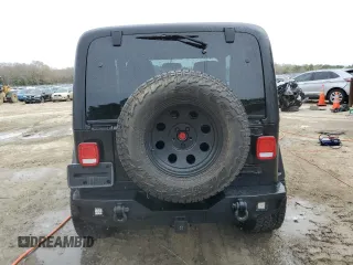 2004 Jeep Wrangler Sahara with VIN 1J4FA59SX4P722608, listed as a Copart auction lot 51223345 with 146,600 mi miles and Salvage title. Bid and sale history available at DreamBid. Image 6.