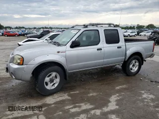 2002 Nissan Frontier SVE with VIN 1N6MD27YX2C370951, listed as a Copart auction lot 59499485 with 180,444 mi miles and Salvage title. Bid and sale history available at DreamBid. Image 1.