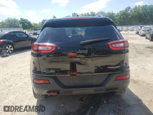 2017 Jeep Cherokee Trailhawk L Plus with VIN 1C4PJMBBXHW517252, listed as a Copart auction lot 51414315 with 185,274 mi miles and Salvage Title. Bid and sale history available at carsss.com. Image 6.