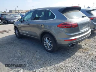 2016 Porsche Cayenne with VIN WP1AA2A21GKA15990, listed as a IAAI auction lot 41978980 with 141,738 mi miles. Bid and sale history available at carsss.com. Image 3.