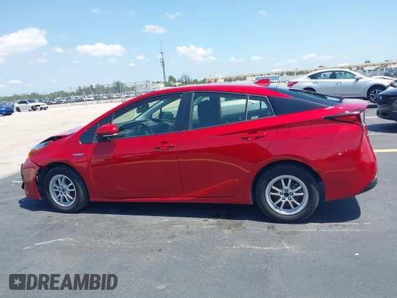 2021 Toyota Prius L Eco with VIN JTDKAMFU4M3145215, listed as a IAAI auction lot 42281566 with 74,220 mi miles and . Bid and sale history available at DreamBid. Image 13.